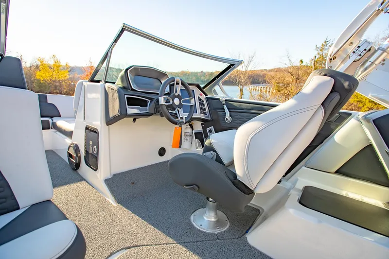 Slide: The Image of 2019 MasterCraft X24 boat interior with modern dashboard and comfortable seating. - 16