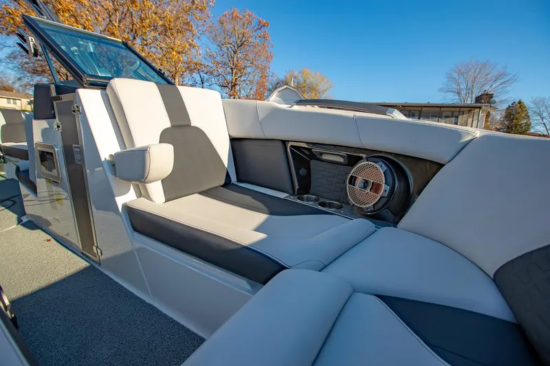 Slide: The Image of 2019 MasterCraft X24 boat interior with plush seating and speaker system. - 27