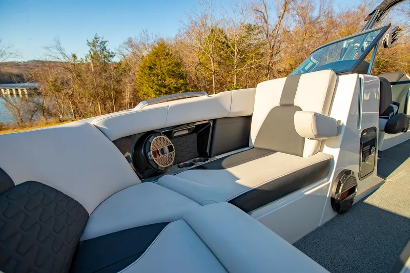 Slide: The Image of 2019 MasterCraft X24 boat interior with luxurious seating and speakers. - 28