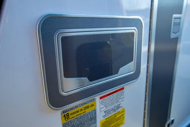 Slide: The Image of Close-up of 2019 MasterCraft X24 boat capacity label and panel. - 30