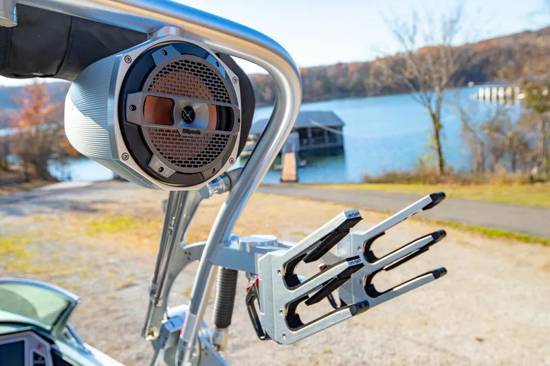 Slide: The Image of Close-up of 2019 MasterCraft X24 boat speaker and wakeboard rack by a lake. - 35
