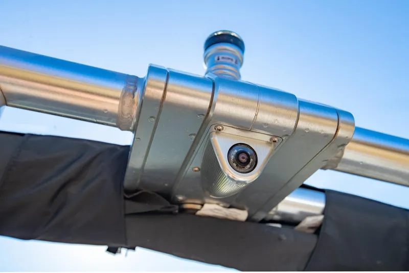 Slide: The Image of MasterCraft X24 2019 boat camera mounted on metal frame under clear blue sky. - 37