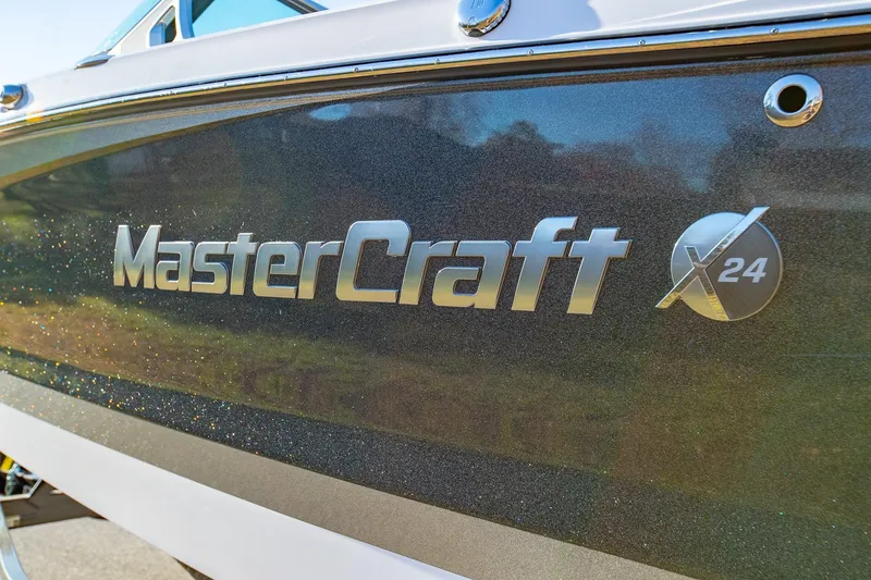 Slide: The Image of Close-up of 2019 MasterCraft X24 boat logo on hull. - 4