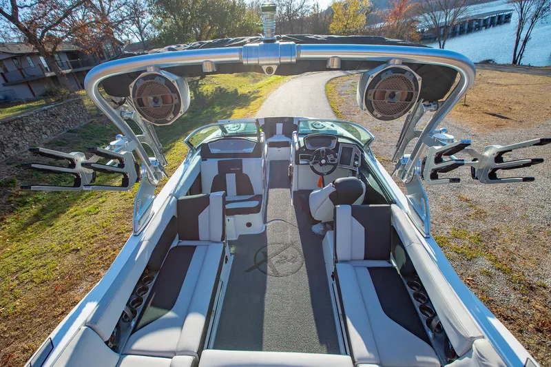 Slide: The Image of 2019 MasterCraft X24 boat interior with spacious seating and advanced audio system. - 7