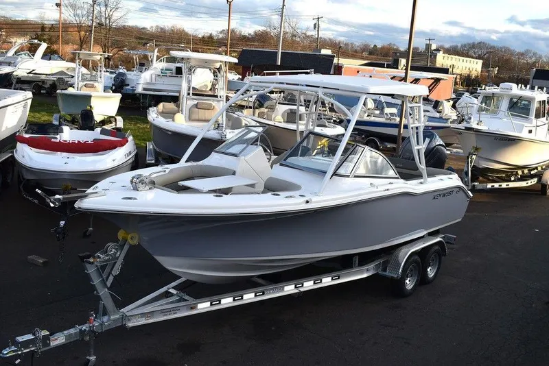 The Image of 2025 Key West 239 DFS boat on trailer in marina setting. - 0