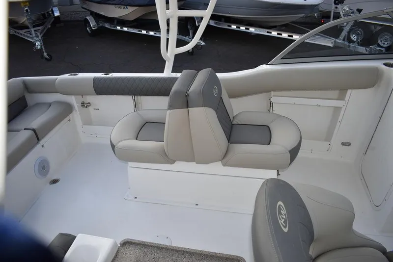 Slide: The Image of 2025 Key West 239 DFS boat interior with gray seating and sleek design. - 12