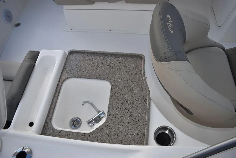 Slide: The Image of 2025 Key West 239 DFS boat interior with sink and seating area. - 15