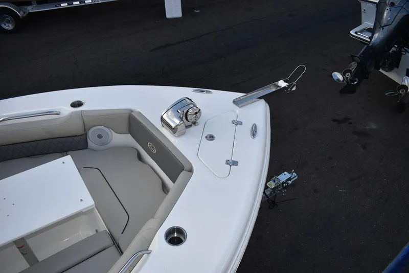 Slide: The Image of 2025 Key West 239 DFS boat bow with anchor and seating area. - 17