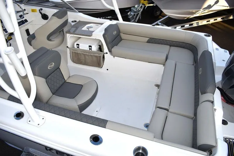 Slide: The Image of 2025 Key West 239 DFS boat interior with gray seating and modern design. - 20