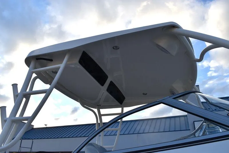 Slide: The Image of 2025 Key West 239 DFS boat with sleek hardtop against a cloudy sky. - 22