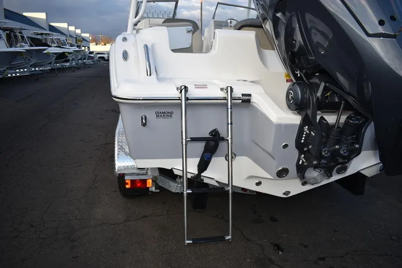 Slide: The Image of 2025 Key West 239 DFS boat rear view with ladder and engine. - 24