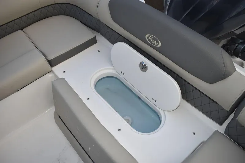 Slide: The Image of 2025 Key West 239 DFS boat interior with seating and storage compartment. - 29