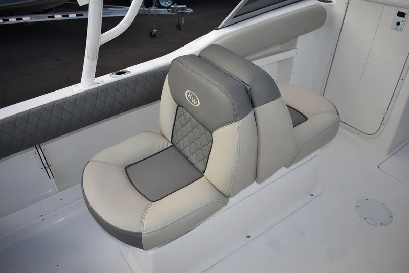 Slide: The Image of 2025 Key West 239 DFS boat seat with gray and beige upholstery. - 32