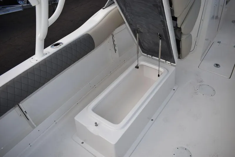 Slide: The Image of 2025 Key West 239 DFS boat with open storage compartment. - 35