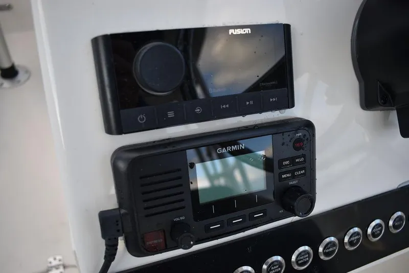 Slide: The Image of 2025 Key West 239 DFS boat dashboard with Fusion and Garmin electronics. - 39