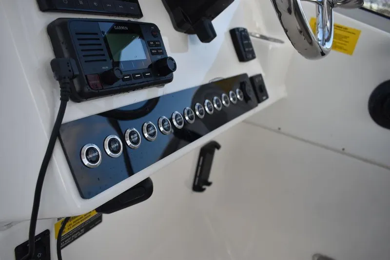 Slide: The Image of 2025 Key West 239 DFS boat dashboard with control panel and navigation equipment. - 42