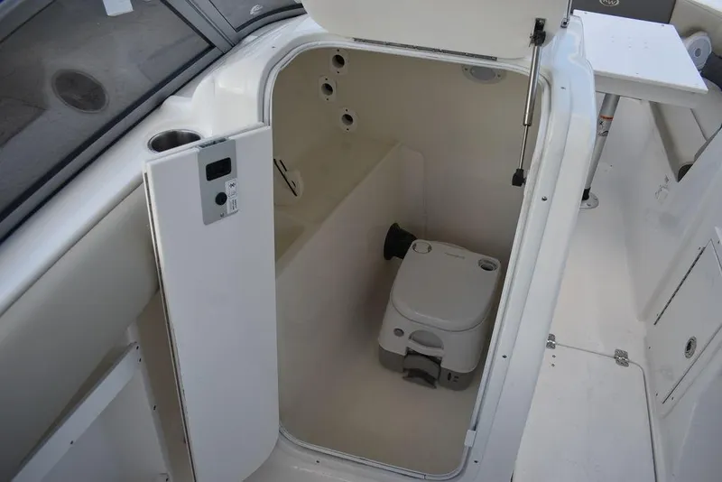 Slide: The Image of 2025 Key West 239 DFS boat interior with compact marine toilet. - 45