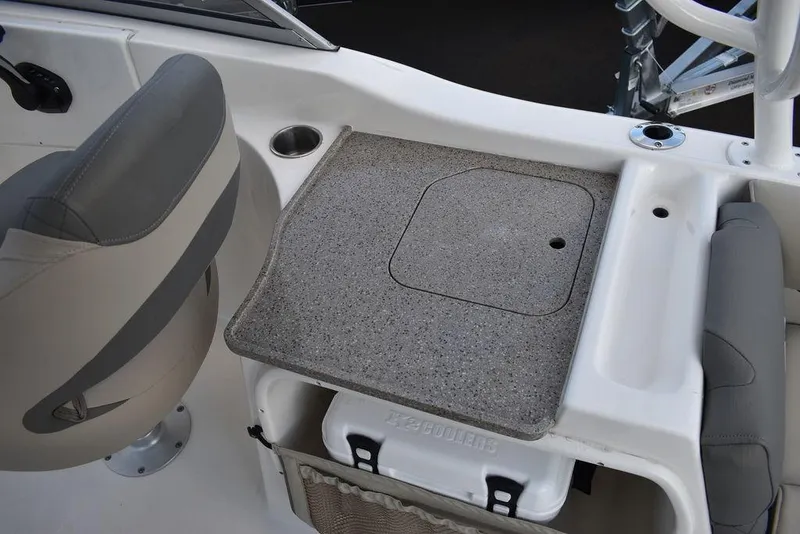 Slide: The Image of 2025 Key West 239 DFS boat interior with seating and storage area. - 48