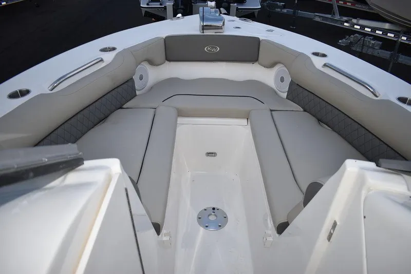 Slide: The Image of 2025 Key West 239 DFS boat interior with cushioned seating and sleek design. - 49