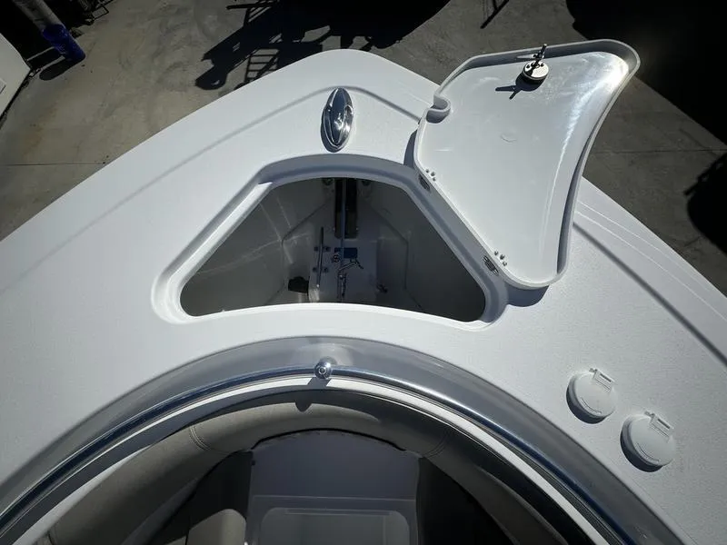 Slide: The Image of 2025 Sportsman OPEN 262 boat with open storage compartment on deck. - 3