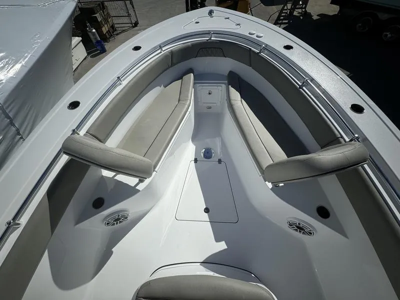 Slide: The Image of 2025 Sportsman OPEN 262 boat interior with cushioned seating and storage compartments. - 4