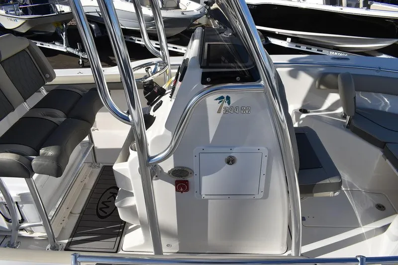 Slide: The Image of 2025 Key West 244 CC boat interior with seating and console. - 12