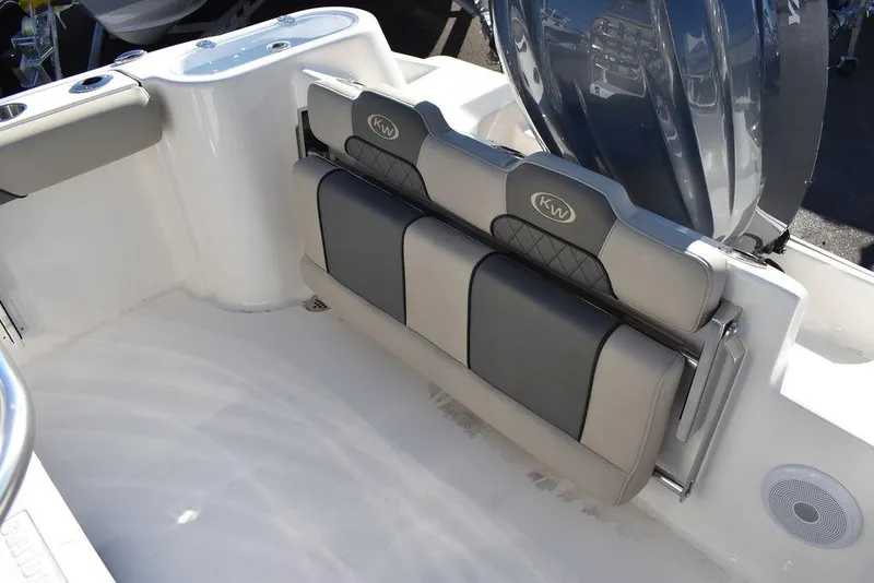 Slide: The Image of 2025 Key West 244 CC boat interior with cushioned seating and modern design. - 20