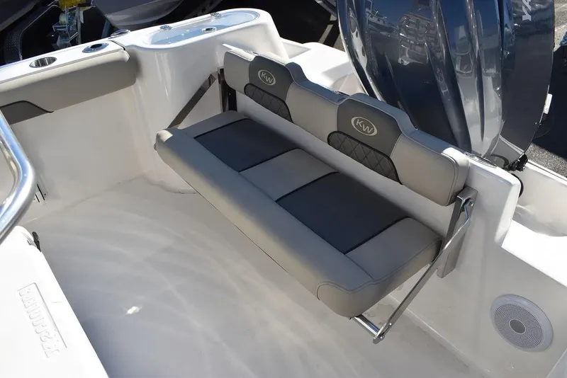 Slide: The Image of 2025 Key West 244 CC boat with foldable rear seating and modern design. - 21