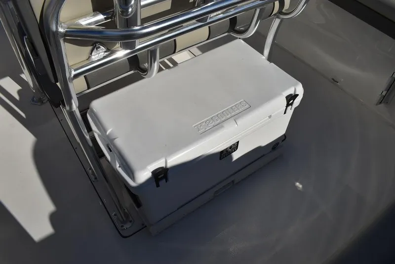 Slide: The Image of White cooler on 2025 Key West 244 CC boat deck, secured with metal frame. - 24