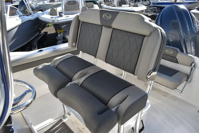 Slide: The Image of 2025 Key West 244 CC boat interior with cushioned seating and modern design. - 28