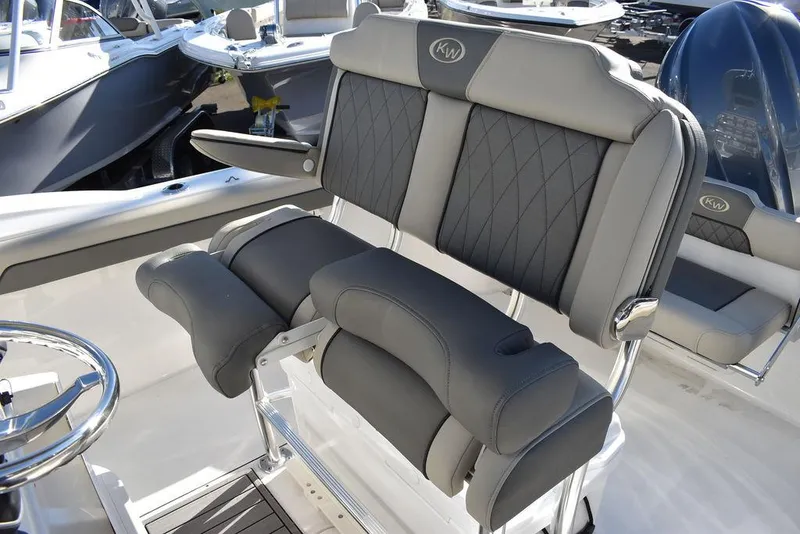 Slide: The Image of 2025 Key West 244 CC boat with luxurious gray seating and modern design. - 30