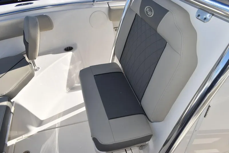 Slide: The Image of 2025 Key West 244 CC boat interior with gray cushioned seating. - 46