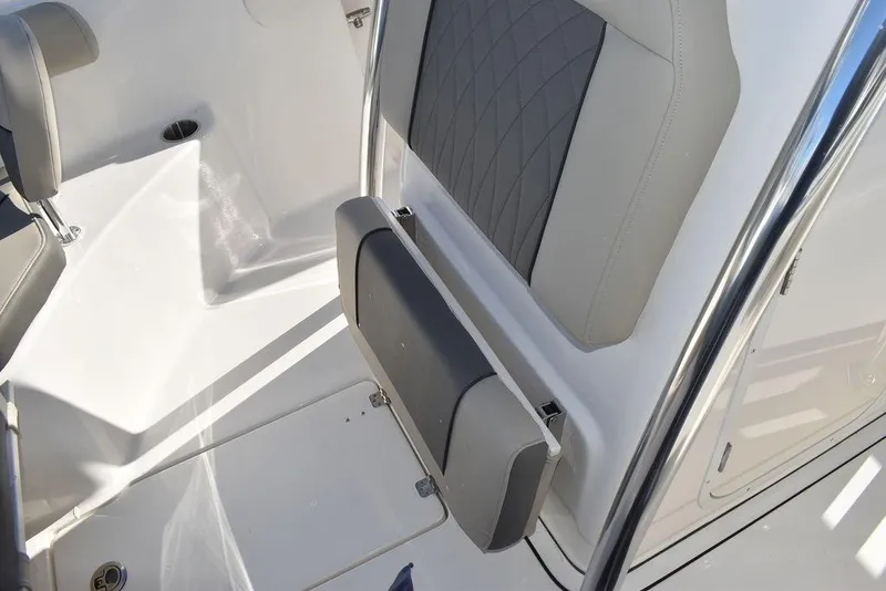 Slide: The Image of 2025 Key West 244 CC boat interior with cushioned seating and sleek design. - 47