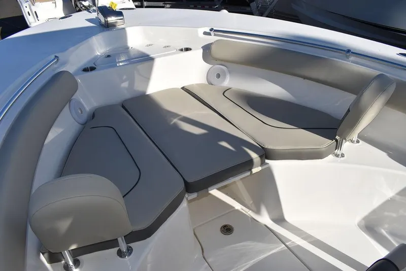 Slide: The Image of 2025 Key West 244 CC boat interior with cushioned seating and sleek design. - 48