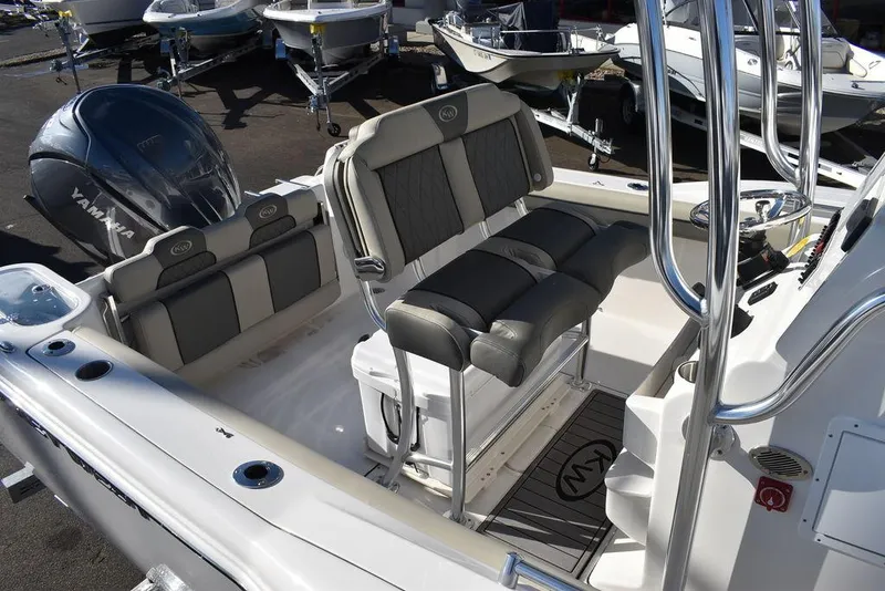 Slide: The Image of 2025 Key West 244 CC boat interior with seating and Yamaha engine. - 11