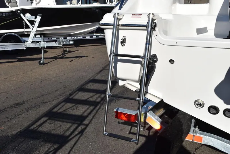 Slide: The Image of 2025 Key West 244 CC boat with ladder on trailer. - 19