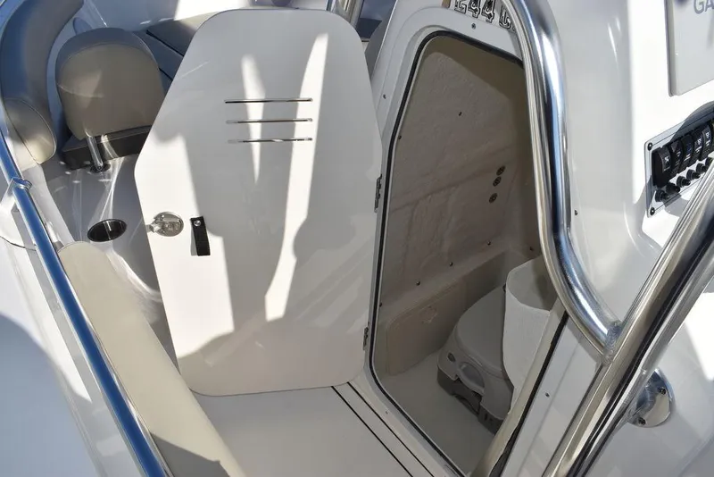 Slide: The Image of 2025 Key West 244 CC boat interior with open cabin door. - 45