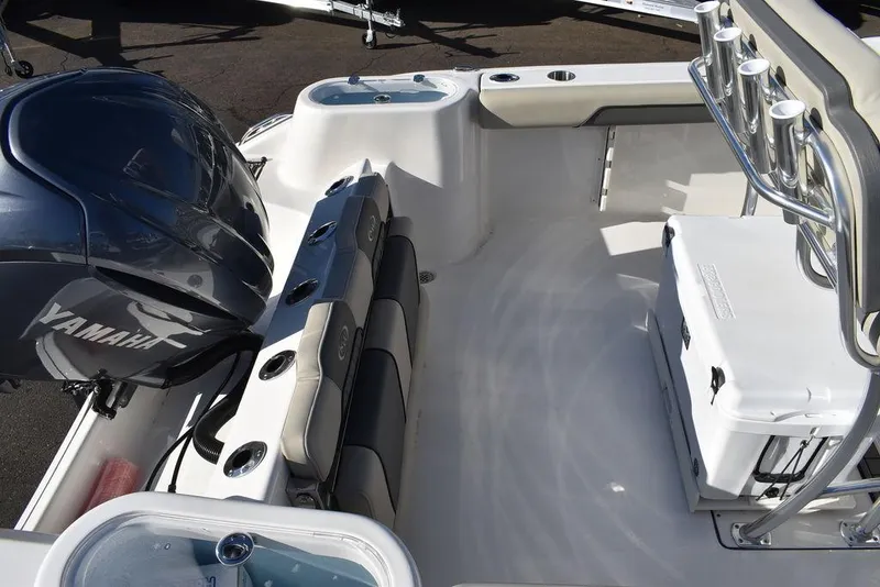 Slide: The Image of 2025 Key West 244 CC boat interior with Yamaha engine and seating area. - 6