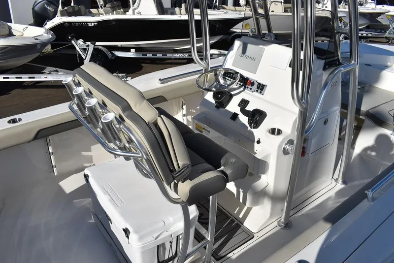 Slide: The Image of 2025 Key West 244 CC boat interior with helm and seating. - 8