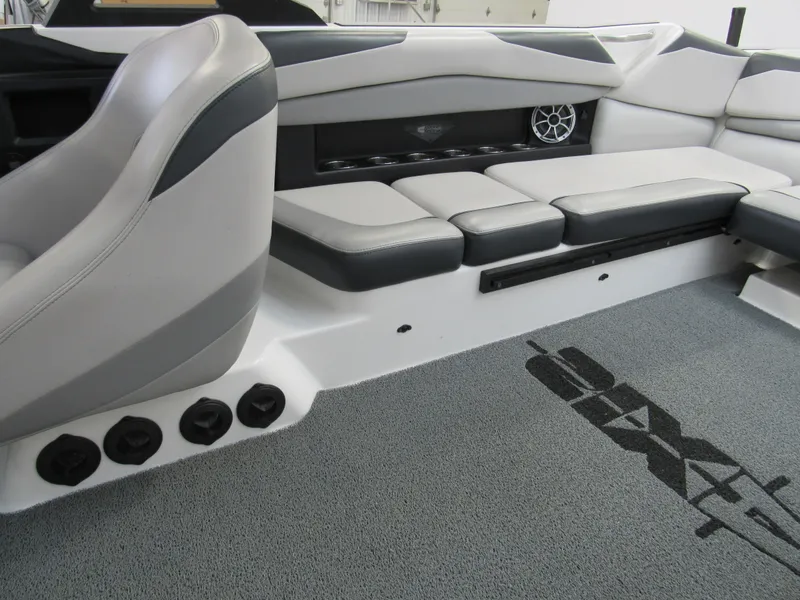 Slide: The Image of 2018 Axis A24 boat interior with gray seating and carpet. - 6