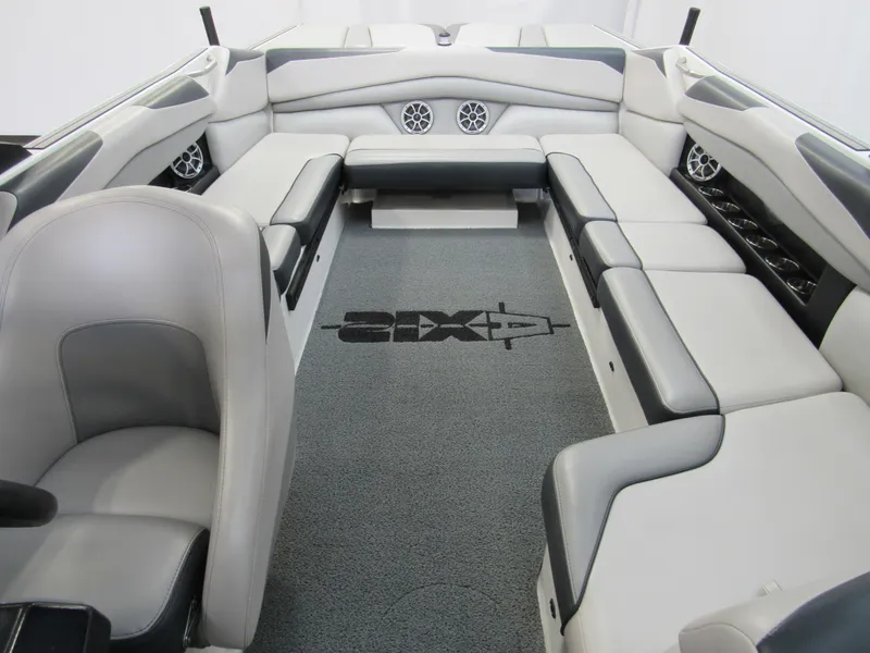 Slide: The Image of 2018 Axis A24 boat interior with gray and black seating, spacious layout. - 9