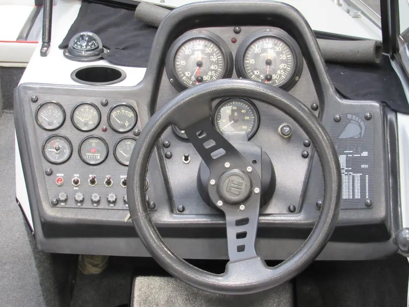 Slide: The Image of 1990 Centurion Falcon BR dashboard with gauges and steering wheel. - 10