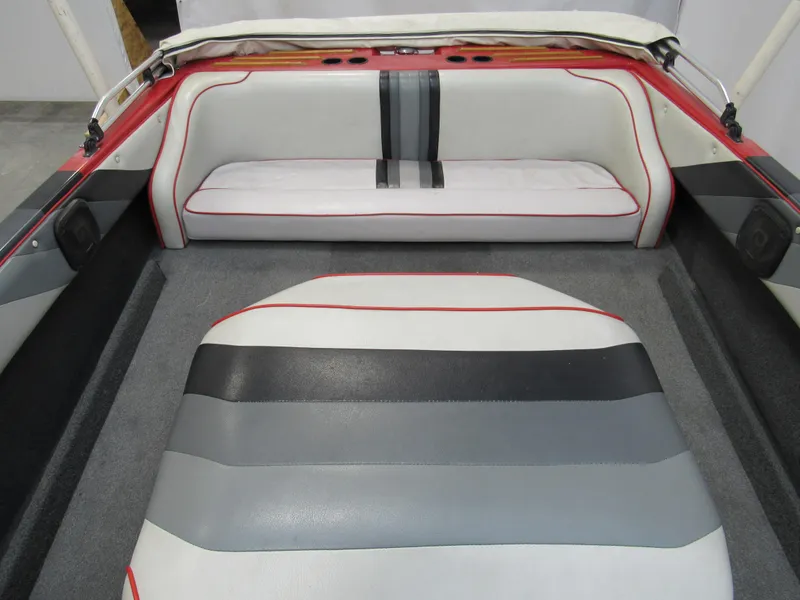 Slide: The Image of Interior of a 1990 Centurion Falcon BR boat with striped upholstery. - 8