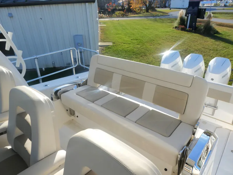 Slide: The Image of 2025 Boston Whaler 420 Outrage boat interior with seating and engines. - 15