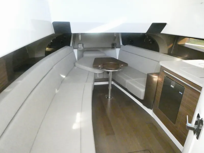 Slide: The Image of Interior of 2025 Boston Whaler 420 Outrage, featuring sleek seating and modern amenities. - 17