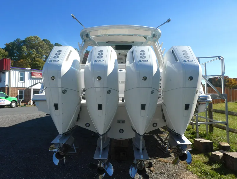 Slide: The Image of 2025 Boston Whaler 420 Outrage with quad outboard engines, rear view. - 5