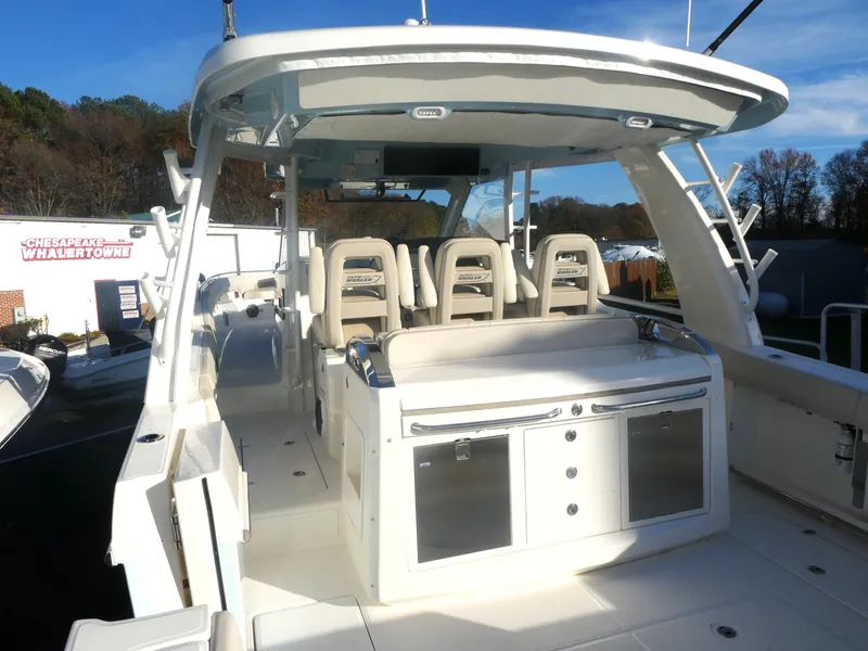 Slide: The Image of 2025 Boston Whaler 420 Outrage boat interior with seating and storage. - 8