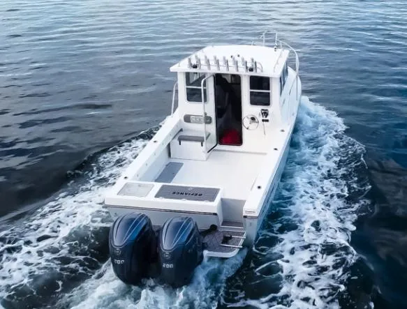 Slide: The Image of 2025 Defiance Admiral 260 EX boat cruising on open water. - 13