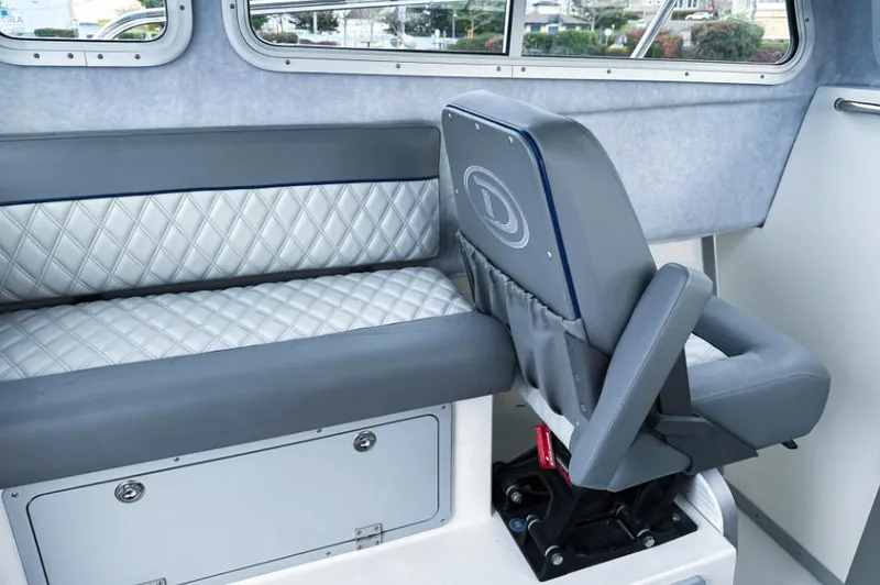 Slide: The Image of 2025 Defiance Admiral 260 EX interior with quilted seating and modern design. - 14