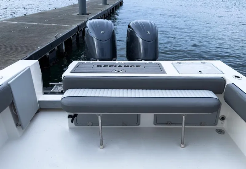Slide: The Image of 2025 Defiance Admiral 260 EX boat with dual engines at dock. - 16